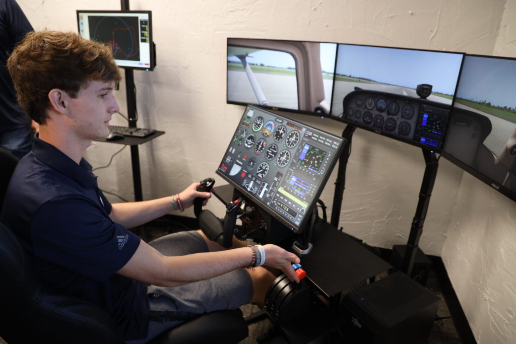 Oklahoma Aviation Academy student using a flight simulator
