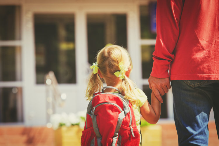 father and little daughter go to school or daycare, education