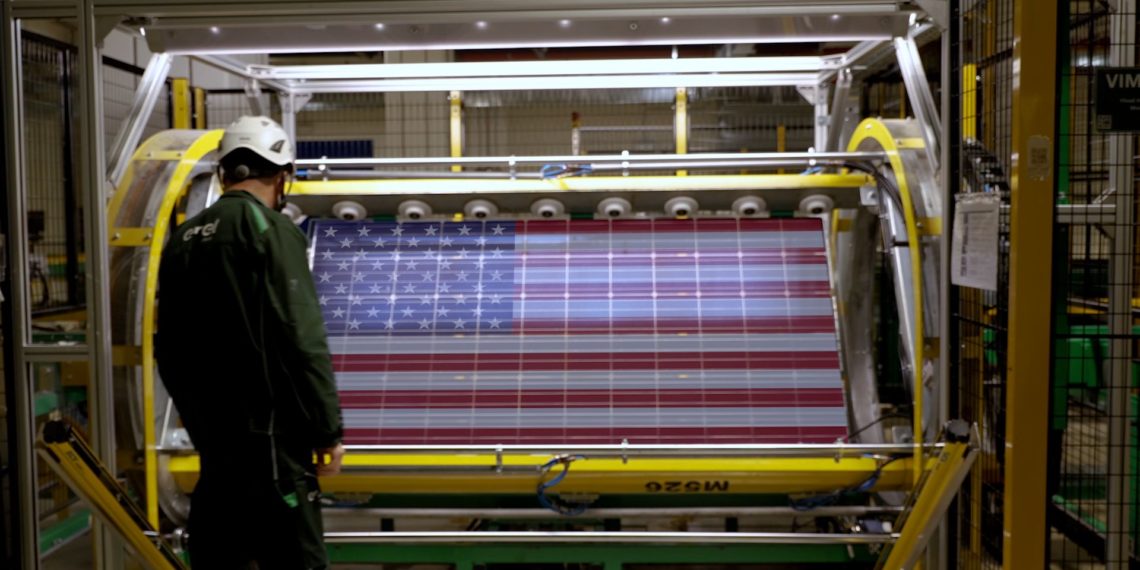 A solar panel with a patriotic theme being manufactured in an Enel facility. Image from Enel.