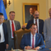 Gov. Kevin Stitt signs Blue Whale Materials' commitment to operate a plant in Bartlesville.