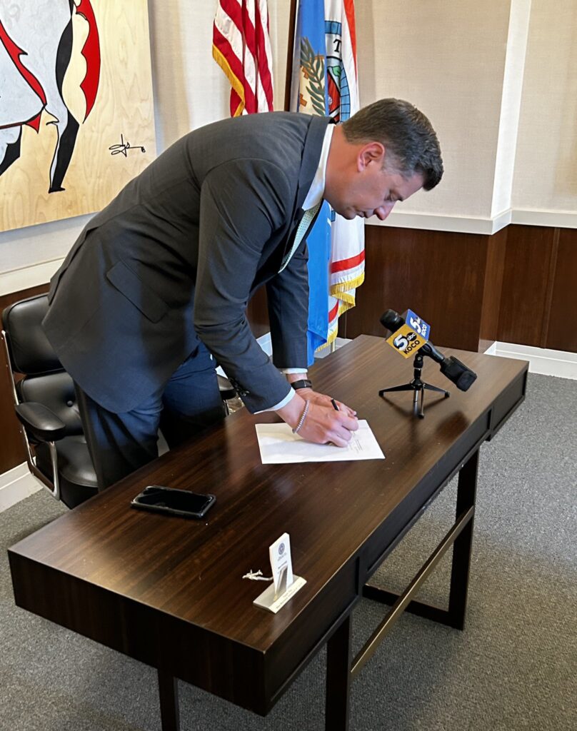 Mayor David Holt cosigns an agreement to keep the OKC Thunder in Oklahoma City beyond 2050.