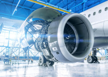 Industrial theme view. Repair and maintenance of aircraft engine on the wing of the aircraft