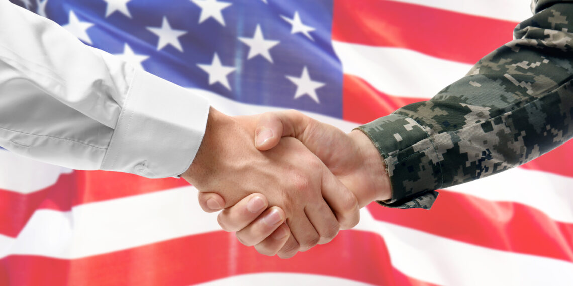 Soldier and civilian shaking hands on white background, closeup