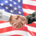 Soldier and civilian shaking hands on white background, closeup