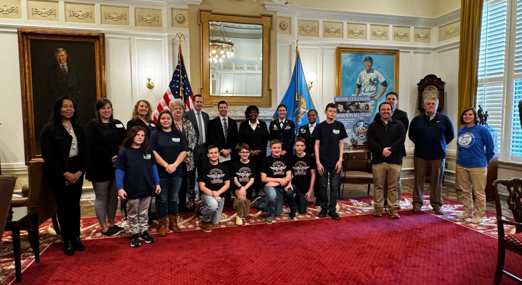 Bessie Coleman Aviation All-Star Program administrators and students with Oklahoma Department of Aerospace and Aeronautics officials.