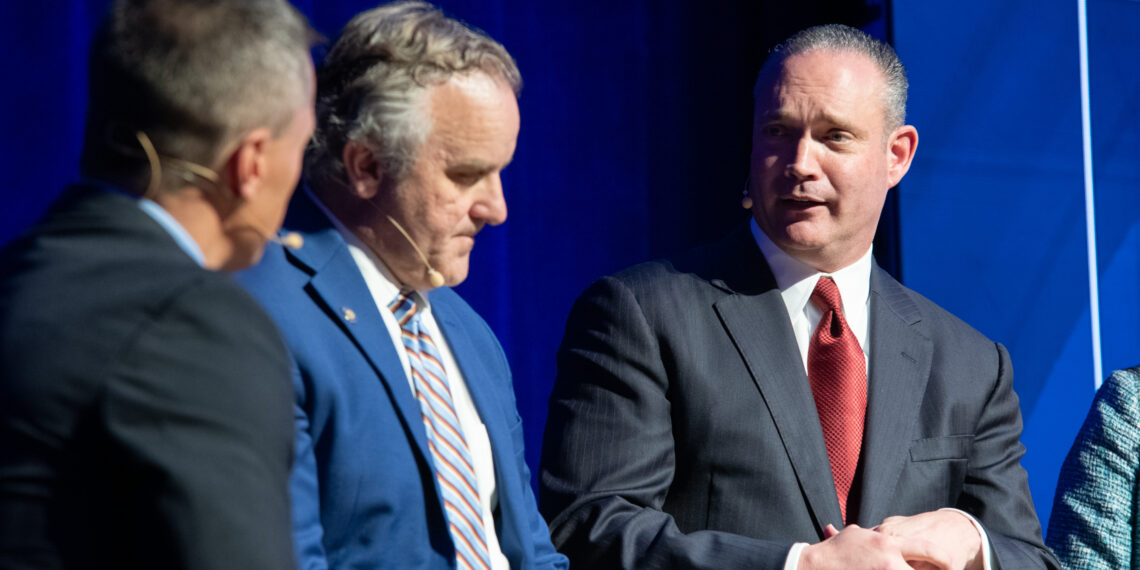 Speaker Charles McCall (right) speaks during the State of Business Forum.