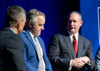 Speaker Charles McCall (right) speaks during the State of Business Forum.