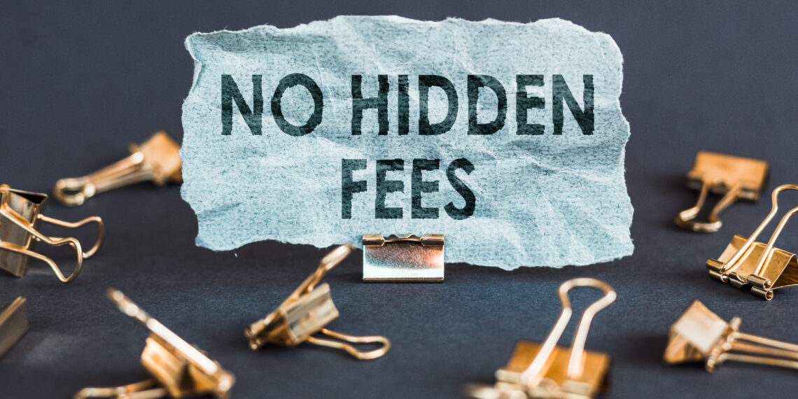 A scrap of blue paper with clips on a gray background with the text - NO HIDDEN FEES.