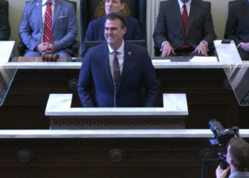 Gov. Kevin Stitt takes the podium to deliver his annual State of the State address.