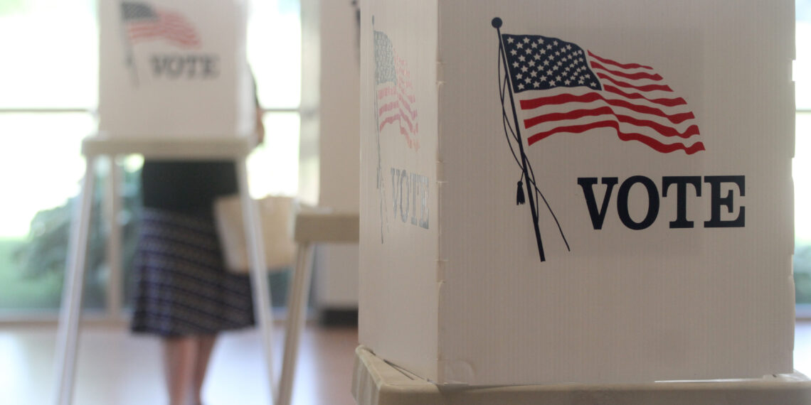 Voting booths stand ready for use in a U.S. election.