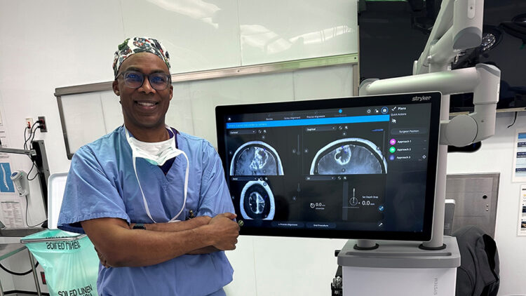 Caple Spence, M.D., standing next to INTEGRIS Health's new Stryker Q technology. Photo from INTEGRIS