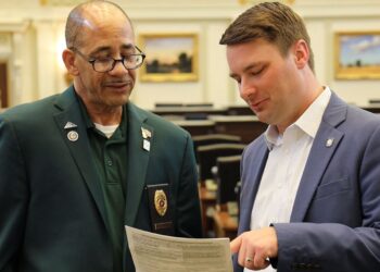 Kyle Hilbert (right) in the House chamber.