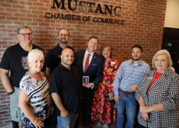 Rep. Brian Hill receiving The State Chamber's Business All-Star Award at the Mustang Chamber of Commerce.