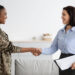 Female Therapist And Happy Black Soldier Woman Handshaking In Office After Meeting, Smiling African American Military Lady Wearing Uniform Grateful To Counselor For Successful Therapy, Copy Space