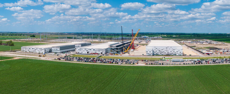 Aerial view of the construction of a massive AI data center campus with 400 million square feet hosting and 600MW capacity in Hutto Texas