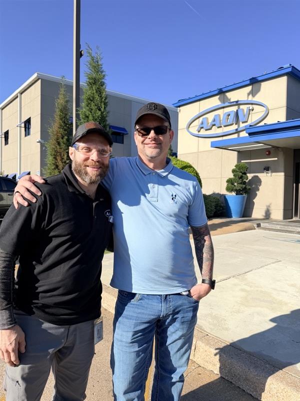 Wes Crawford and a colleague standing outside AAON’s Tulsa operations