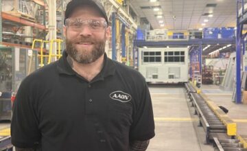 Wes Crawford standing on the production floor at AAON in Tulsa