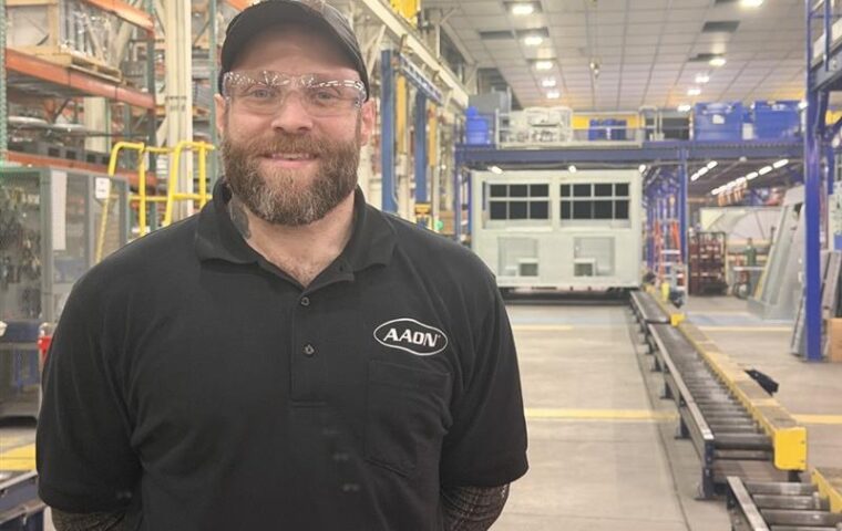 Wes Crawford standing on the production floor at AAON in Tulsa